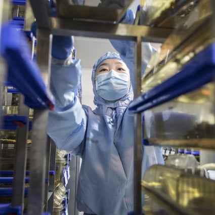 A technician loads containers on a rack at a Cyagen Biosciences facility in Jiangsu province, China, in March. Photo: Bloomberg