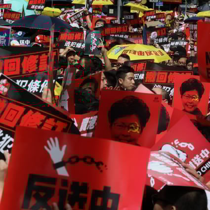 Protesters march against the extradition bill in Hong Kong on Sunday. Photo: KY Cheng