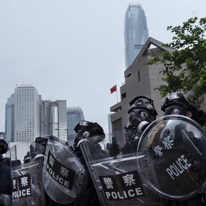 Police officers prepare to disperse a protest against the extradition bill in Hong Kong on June 12. As the China-US economic cold war escalates, and rising regulatory hurdles make it harder for Chinese companies to raise capital in the US, Hong Kong will become immensely valuable to China as an offshore financial centre. Photo: DPA