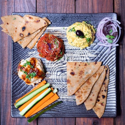 Cardamon Street’s mezze platter is served with pita bread flavoured with spices like rosemary.