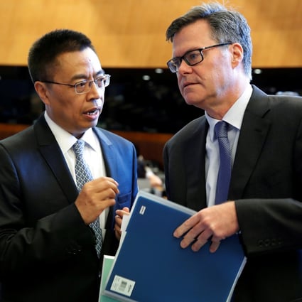 Dennis Shea, US Ambassador to the WTO talks with Xiangchen Zhang, Chinese Ambassador to the WTO before the General Council meeting at the World Trade Organisation in Geneva, Switzerland, July 26, 2018. Photo: Reuters