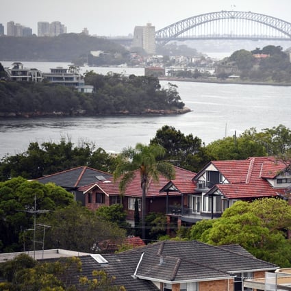 Property analysts point to the results of a land auction on June 8 where 62 per cent of properties were sold as an indicator that the property market was turning around. Single detached houses in inner Sydney, Australia are framed by the Sydney Harbour Bridge. Photo: EPA