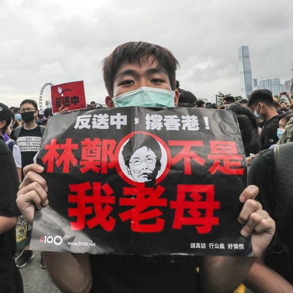 Protesters outside government headquarters in Tamar call for the withdrawal of the extradition bill and city leader Carrie Lam to resign. Photo: Sam Tsang