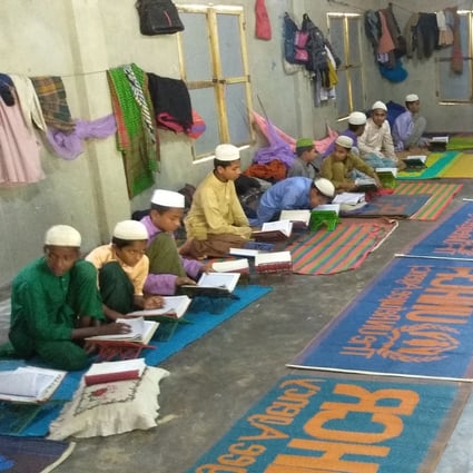 Rohingya refugee children learn the Koran in a madrasa, or Islamic school, in a Rohingya refugee camp in Ukhia. Photo: AFP