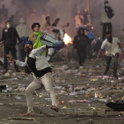Prabowo Subianto supporters clash with riot police in Jakarta. Photo: AP