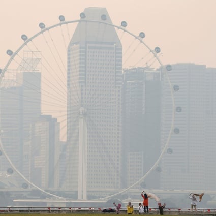 The Singapore Flyer observatory wheel is shrouded by haze. Photo: Reuters