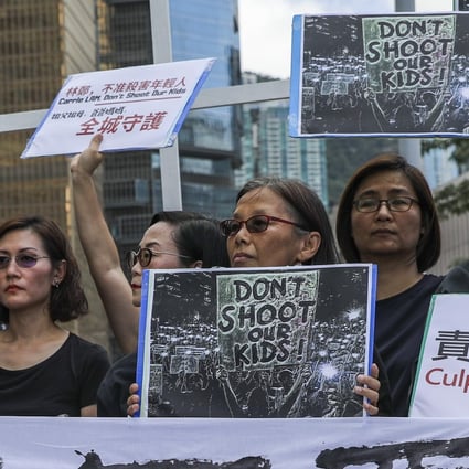 Protest groups, including teachers, parents, religious officials and two lawmakers gather outside the Chief Executive’s Office on Thursday. Photo: Sam Tsang