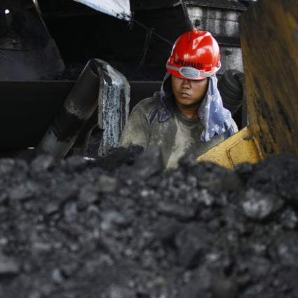 A miner at the Tarahan coal port in Lampung province, Indonesia. The US-China trade war could hit Indonesia’s raw goods exports. Photo: Reuters