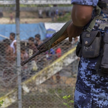Myanmar border guard police patrol the fence in the ‘no man's land’ zone between Myanmar and Bangladesh. Photo: AFP