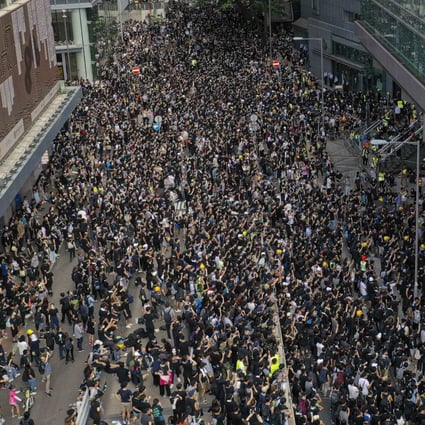Protesters outside police headquarters in Wan Chai on Friday. Photos: Martin Chan