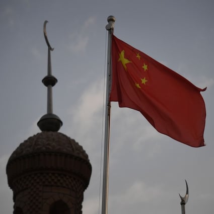 The Chinese flag flies over a mosque in Kashgar, Xinjiang. Photo: AFP