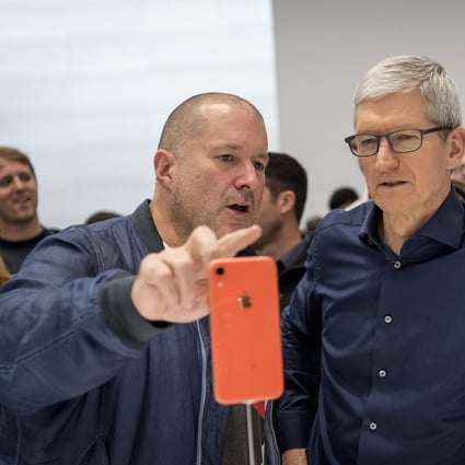 Jony Ive, chief design officer for Apple, left, and Tim Cook, chief executive officer, view a new iPhone during Apple's annual product event.Photo: Bloomberg