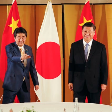 Shinzo Abe invited Xi Jinping to visit Japan in cherry blossom season next year. Photo: Bloomberg