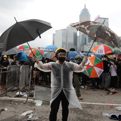 Protesters in makeshift protective gear surround Hong Kong’s legislature on June 12. Photo: Felix Wong