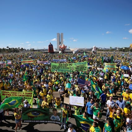 Demonstrators attend a protest against corruption in Brasilia. Photo: Reuters