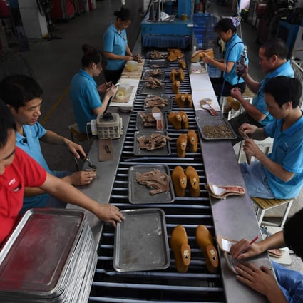 Wang Jie said his Yintong Shoes factory in Dongguan has continued to lose orders from the US in recent months. Photo: AFP