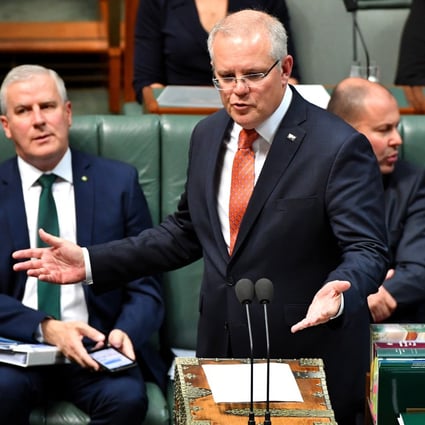 Prime Minister Scott Morrison speaks at the dispatch box in the House of Representatives at Parliament House in Canberra. Photo: EPA