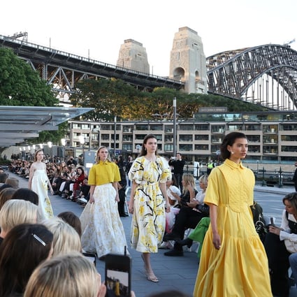 Models show looks from Aje in the shadow of Sydney Harbour Bridge. An Aboriginal councillor spoke before the show, as Aje’s Edwina Forest explains: “We were presenting in a space that’s not traditionally our land but the indigenous people’s land so it was important to us that we started with an acknowledgement of that.” Photo: Lisa Maree Williams/Getty Images