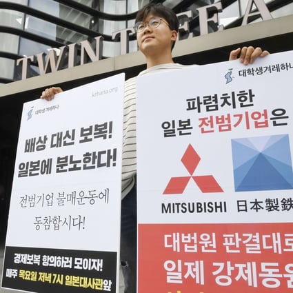 A man protests against Japan’s decision to restrict exports outside the Japanese embassy in Seoul. Photo: Kyodo