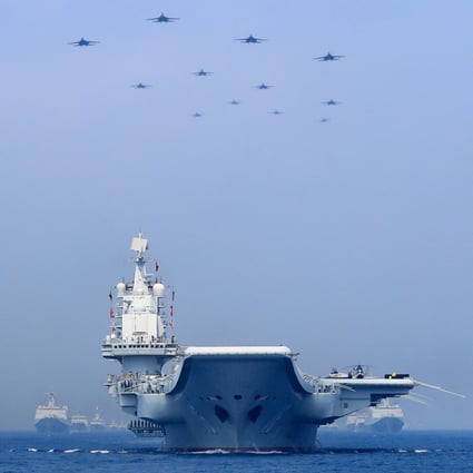 Chinese People's Liberation Army Navy warships and planes take part in a military display in the South China Sea in April. Photo: Reuters