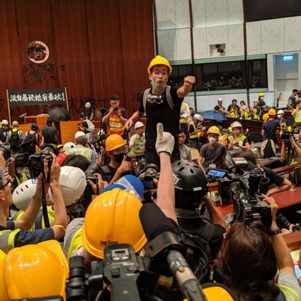 Brian Leung pleads with protesters who have stormed the Legco chamber to stay. Photo: Sum Lok-kei