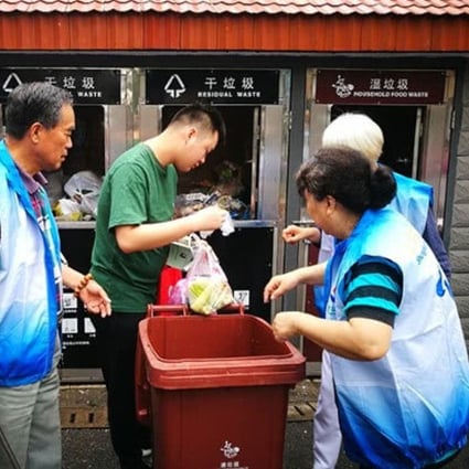 Shanghai has recruited an army of volunteers, many of them elderly, to help neighbours with the city’s new rubbish collection scheme. Photo: Weibo