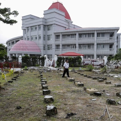 After Cyclone Gita damaged Tonga’s Parliament House last year, the government suggested China might like to pay to rebuild it. Photo: AP