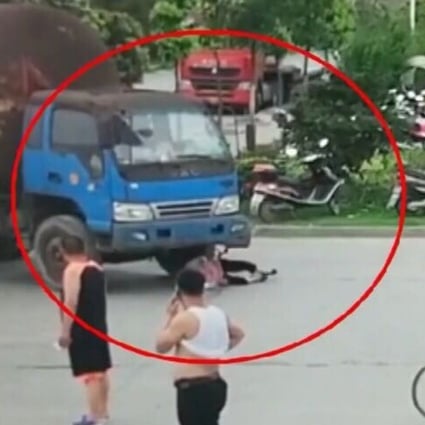 The woman’s efforts to fake a road accident were caught on camera. Photo: AP