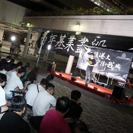 More than 100 students, alumni and staff gather at the University of Hong Kong campus, urging the president and vice-chancellor Zhang Xiang to retract a statement they saw as biased against the protest movement. Photo: Jonathan Wong