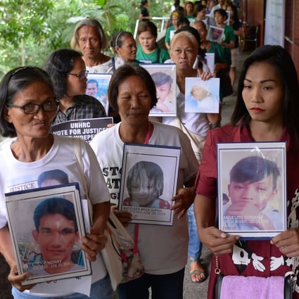 Relatives of drug war victims at a memorial mass in Manila on July 9, 2019. Photo: AFP