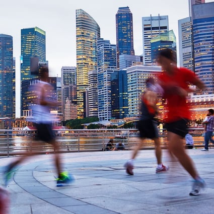 Runners go for an evening jog in Singapore. The Lion City is a popular destination for running tours. Photo: Alamy