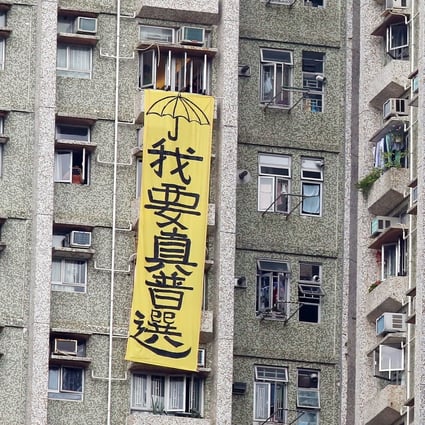 A protest banner hangs from the window of a flat in 2016, saying “I want real elections”, complete with a yellow umbrella, the symbol of the 2014 Occupy movement, then Hong Kong’s largest pro-democracy demonstration. Photo: Nora Tam