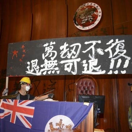 On July 1, protesters stormed the Legislative Council chamber and put up Hong Kong’s colonial-era flag underneath a banner saying, “Forced to the point of no return”. Photo: Antony Dickson
