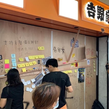 Protesters in Sha Tin leave messages at a Yoshinoya outlet, which had boarded its windows ahead of a anti-extradition bill rally. Photo: Zoe Low