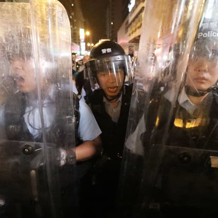 Riot police push forward at an extradition bill protest in Mong Kok on July 7. Photo: Felix Wong