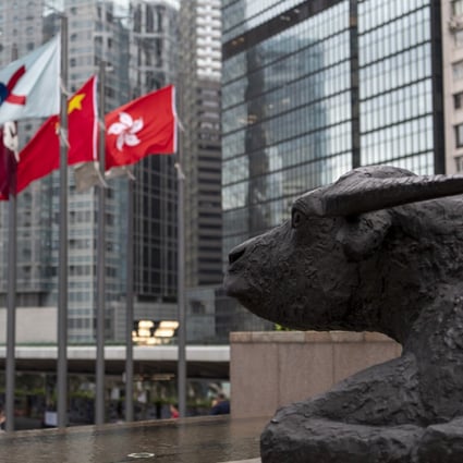 A bronze sculpture of a bull looks over Exchange Square in Central where Hong Kong’s stock exchange stands. Hong Kong’s position as the most important financial market in Asia relies on freedom of information. Photo: Warton Li