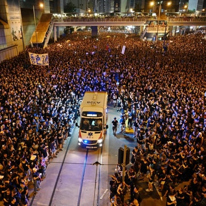 Crowds part to allow an ambulance through during a rally on June 16 against the Hong Kong government’s proposal to amend the city’s extradition laws that would allow the transfer of fugitives to mainland China. Photo: AFP