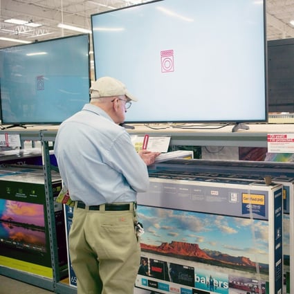 A customer looks over televisions on display at a BJ's Wholesale Club store in Stoneham, Massachusetts, USA, 16 May 2019. EPA-EFE/CJ GUNTHER