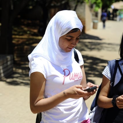Students use their mobile phones at the Witwatersrand University in Johannesburg, South Africa. In the first quarter of this year Africa’s smartphone shipments declined 7.1 per cent quarter on quarter to 21.5 million units. Photo: AFP