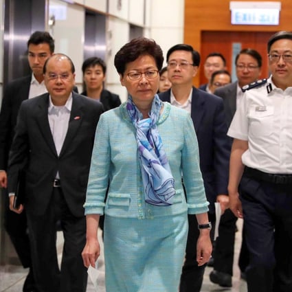 Chief Executive Carrie Lam Cheng Yuet-ngor heads to a press briefing at 4am on June 2 at the police headquarters in Wan Chai, after extradition bill protesters occupied the Legislative Council complex. Following behind are (from left) Chief Secretary Matthew Cheung Kin-chung, Secretary for Security John Lee Ka-chiu and Police Commissioner Stephen Lo Wai-chung. Photo: Edmond So