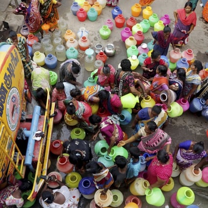 Indians stand in queues to collect drinking water from a tanker in Chennai. Photo: AP