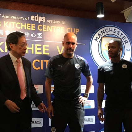 Pep Guardiola (centre) and Raheem Sterling (right) with Kitchee president Ken Ng at Tuesday’s press conference. Photo: Nicolas Atkin
