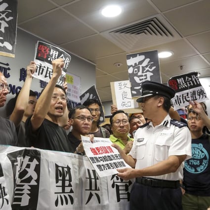 Protesters demonstrate at Yuen Long police station the day after a group of thugs attacked passengers in a train station. Photo: Felix Wong