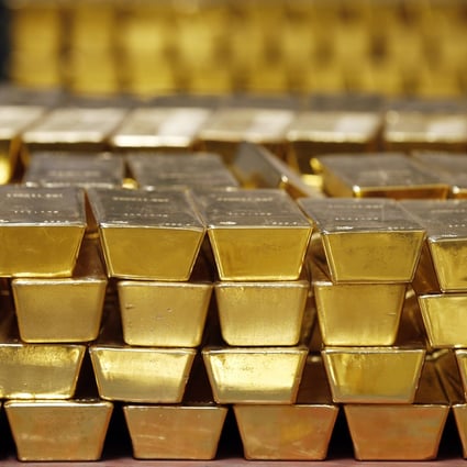 Gold bars stacked in a vault in West Point, New York. A reversal in the US commitment to a strong dollar could cause investors to sell the dollar and buy up gold. Photo: AP