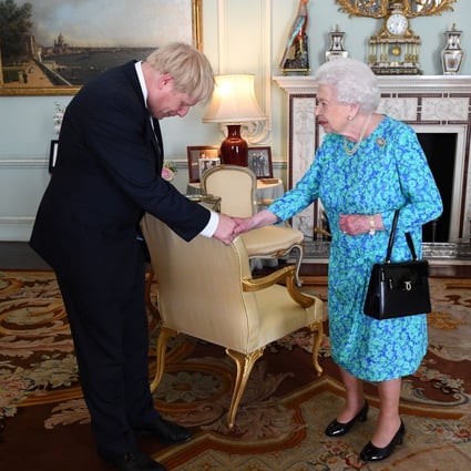 Queen Elizabeth welcomes Boris Johnson during an audience in Buckingham Palace. Photo: Reuters