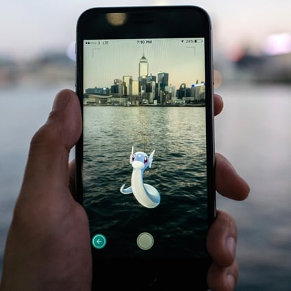 A Hong Kong Pokemon Go player finds a Dratini, a dragon type Pokemon, in Victoria Harbour. Photo: Bloomberg