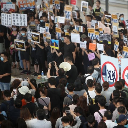 Airport workers and other protesters stage a sit-in at Hong Kong International Airport demanding the complete withdrawal of the divisive extradition bill. Photo: Winson Wong