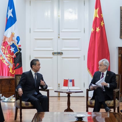 Chilean President Sebastian Pinera speaks with Chinese Foreign Minister Wang Yi (left) at the government house in Santiago, Chile, on Saturday. Photo: Reuters