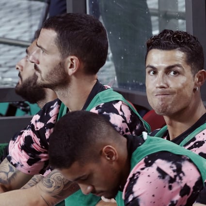 Cristiano Ronaldo sits on the bench before a friendly match against Team K League at the Seoul World Cup Stadium in Seoul. Photo: AP