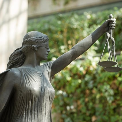 The statue of Lady Justice in the British Columbia Supreme Court complex in Vancouver. Photo: Alamy